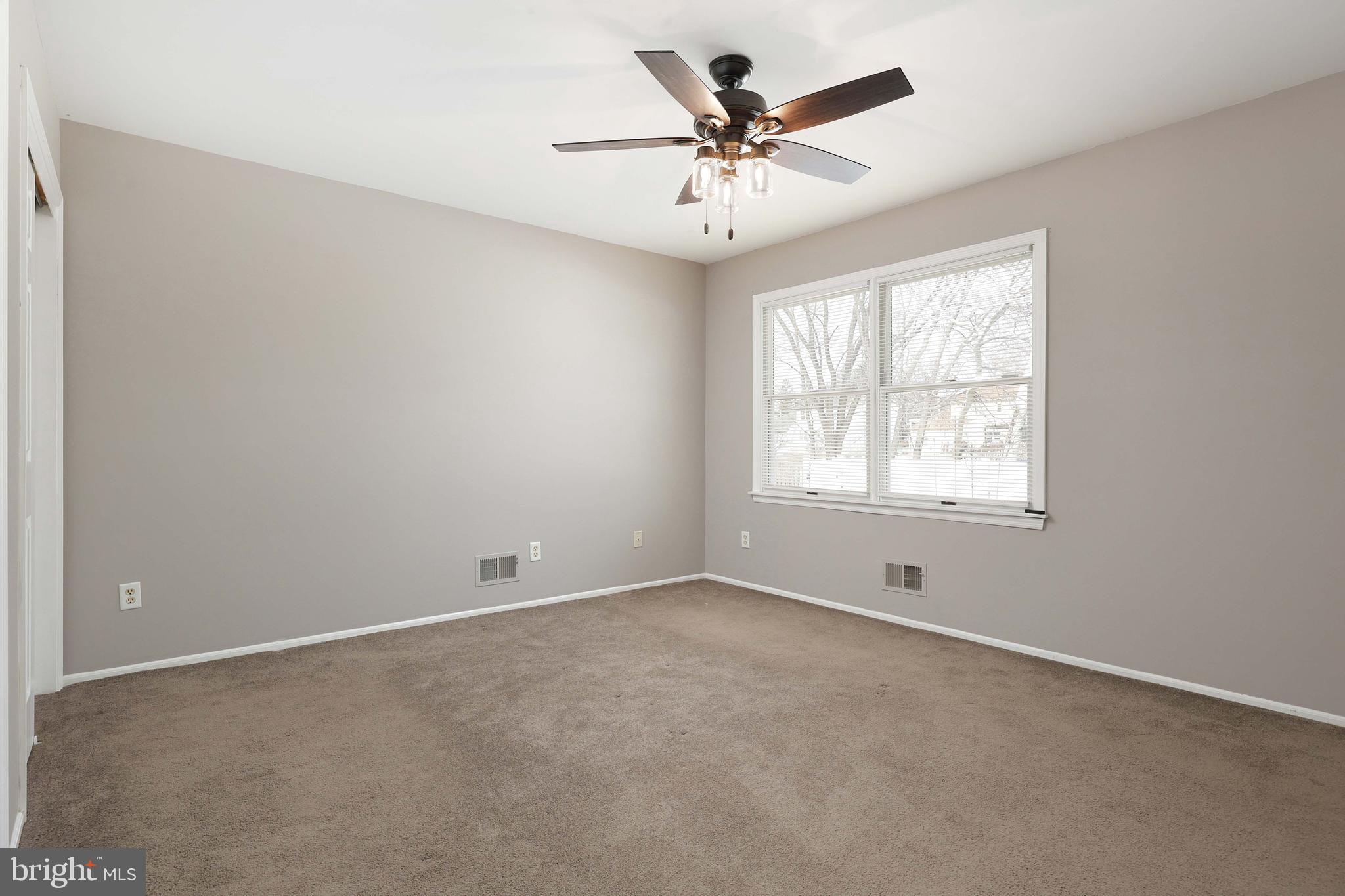 285 Manor Boulevard Hamilton, NJ 08620 - Photo 19 of 35 an empty room with a window and a fan