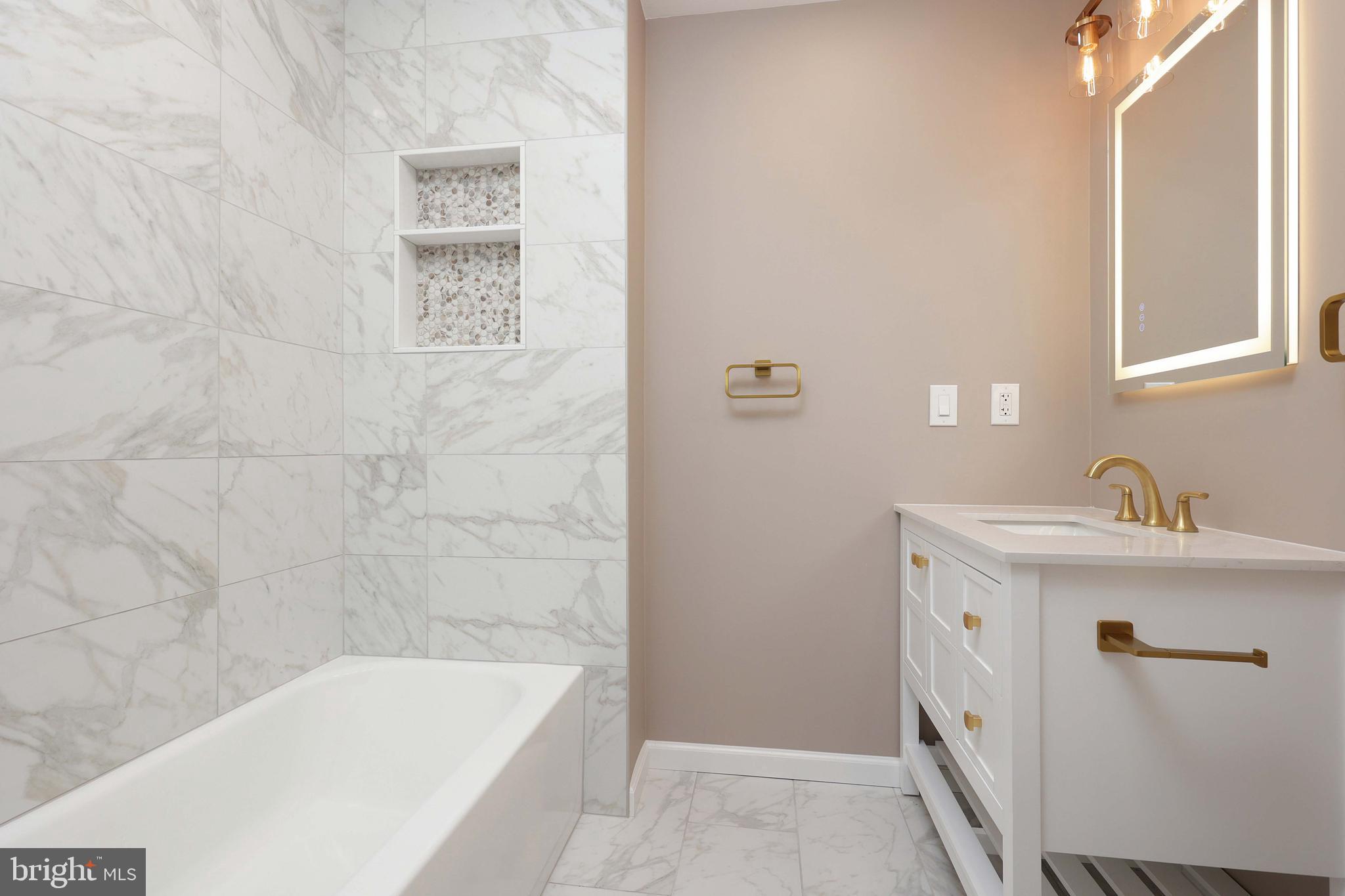 285 Manor Boulevard Hamilton, NJ 08620 - Photo 21 of 35 a bathroom with a sink a bathtub and a window