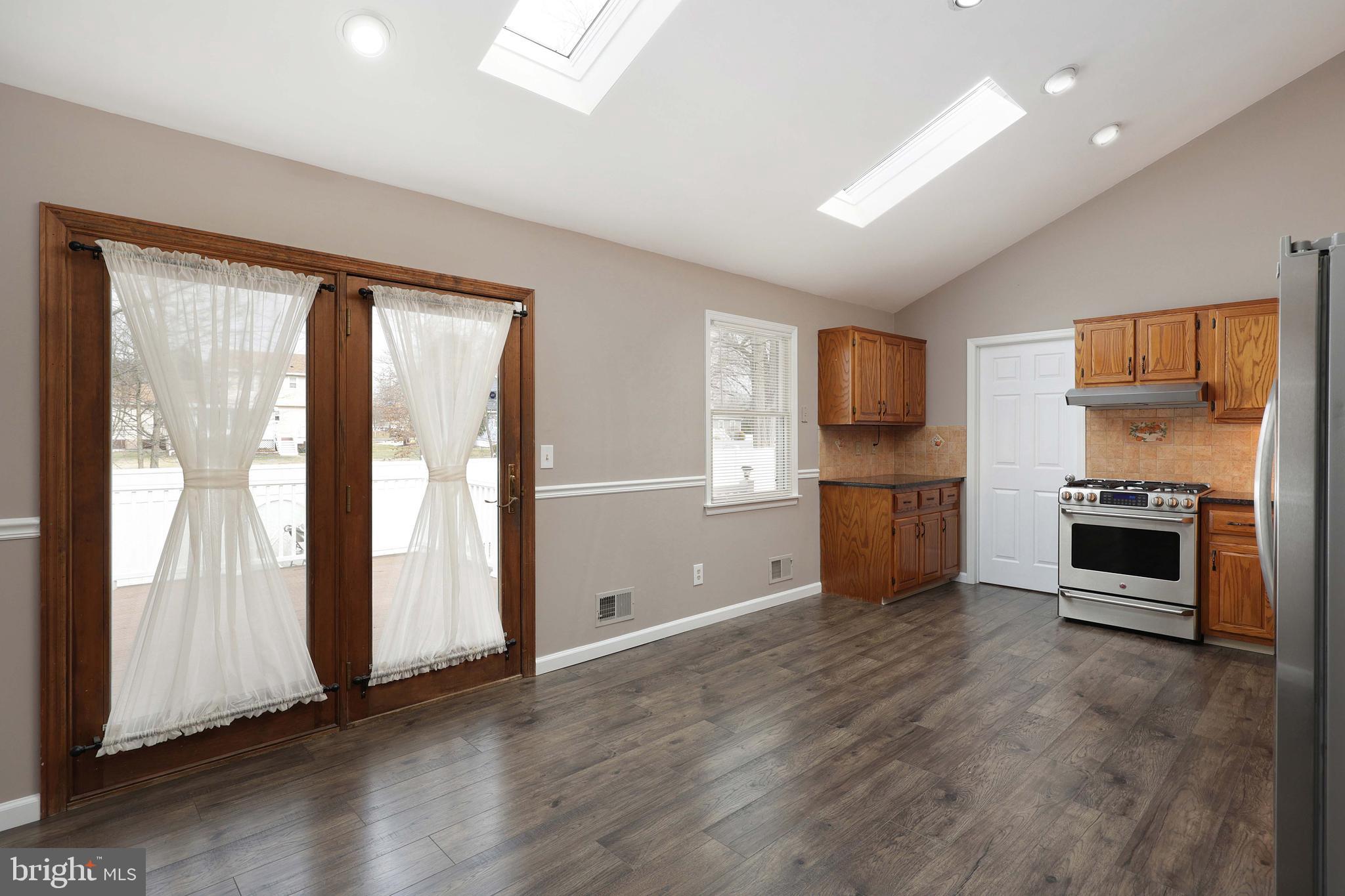 285 Manor Boulevard Hamilton, NJ 08620 - Photo 9 of 35 a view of a kitchen with a sink dishwasher cabinets and a kitchen