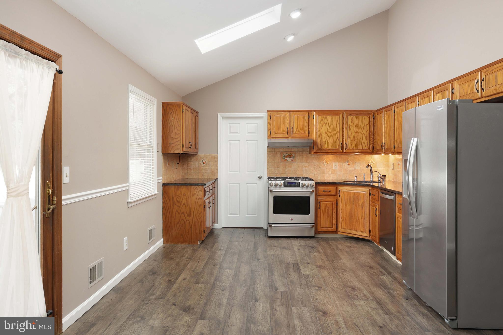 285 Manor Boulevard Hamilton, NJ 08620 - Photo 10 of 35 a kitchen with a refrigerator and a sink