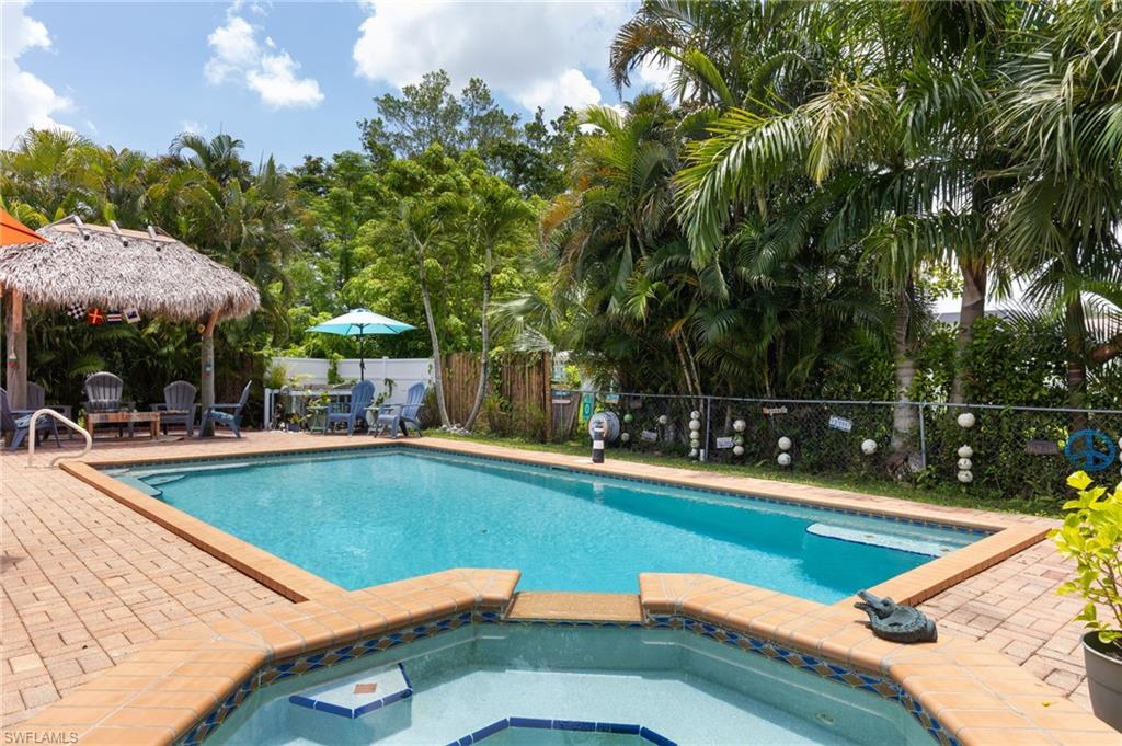1660 South Hermitage Road Fort Myers, FL 33919 - Photo 1 of 21 a view of a swimming pool with lounge chairs