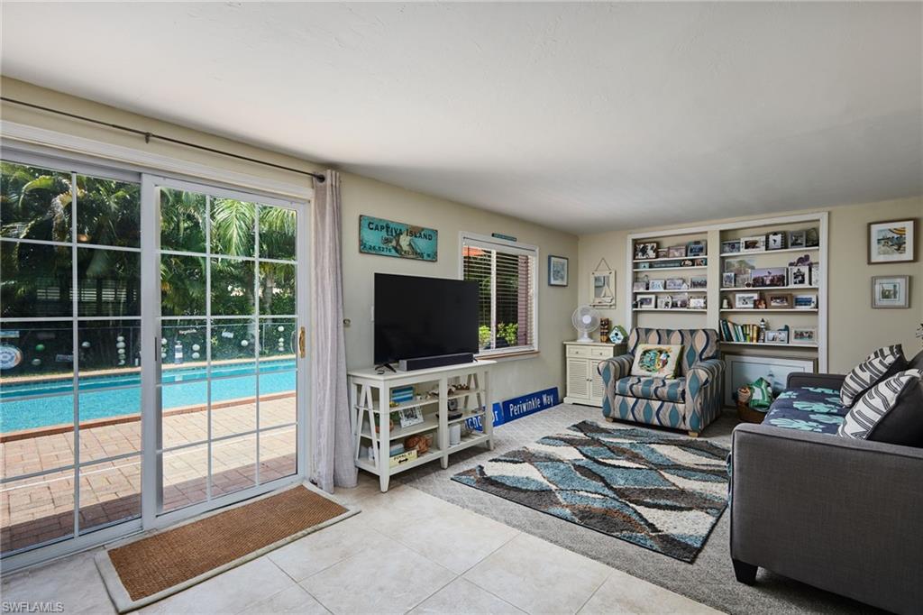 1660 South Hermitage Road Fort Myers, FL 33919 - Photo 12 of 21 a living room with furniture and a flat screen tv