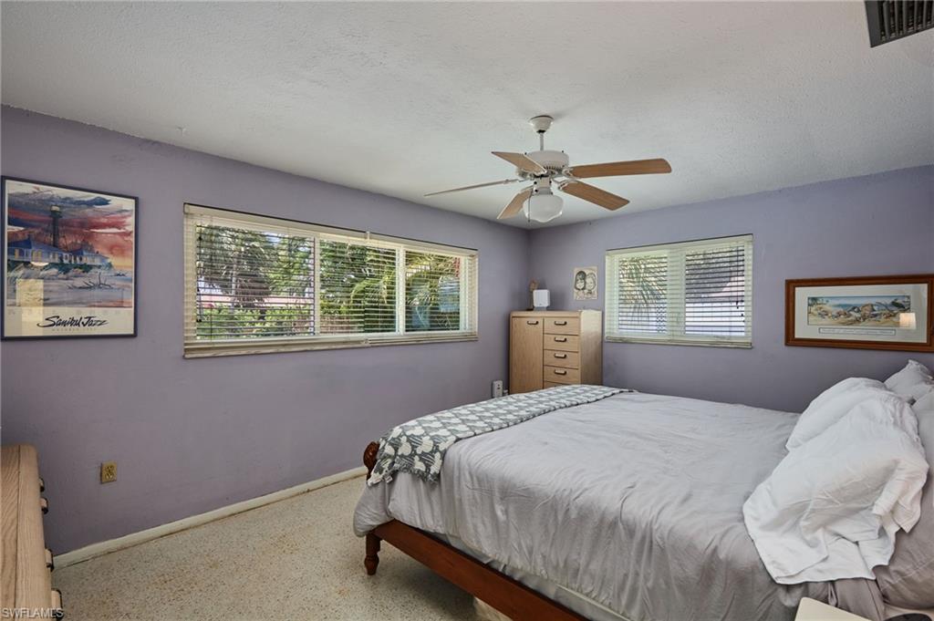 1660 South Hermitage Road Fort Myers, FL 33919 - Photo 14 of 21 a bedroom with a large bed and a window