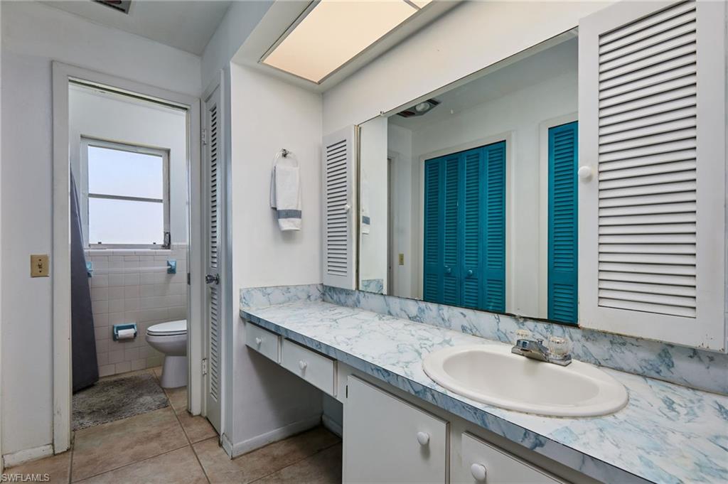 1660 South Hermitage Road Fort Myers, FL 33919 - Photo 15 of 21 a bathroom with a granite countertop sink and a mirror