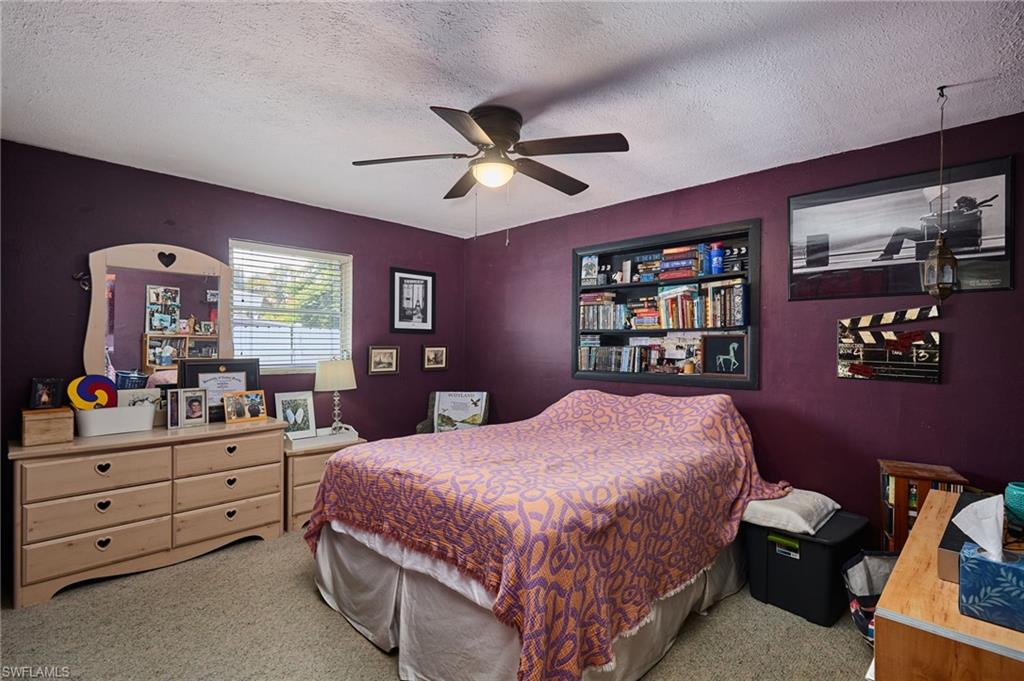 1660 South Hermitage Road Fort Myers, FL 33919 - Photo 18 of 21 a bedroom with a bed and dresser