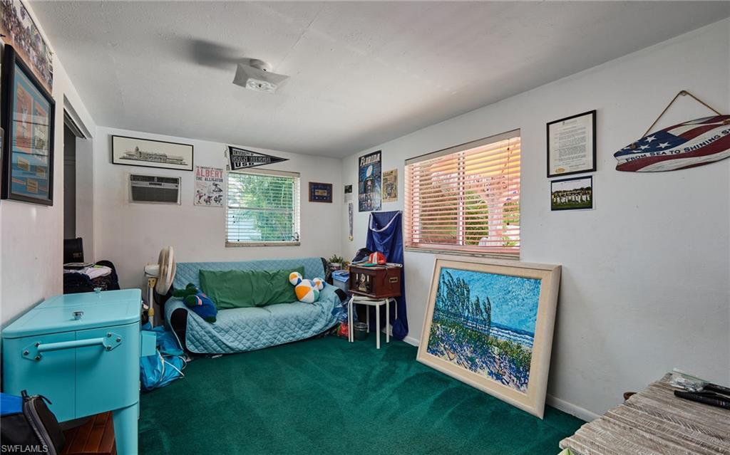 1660 South Hermitage Road Fort Myers, FL 33919 - Photo 19 of 21 a living room with furniture and a fireplace