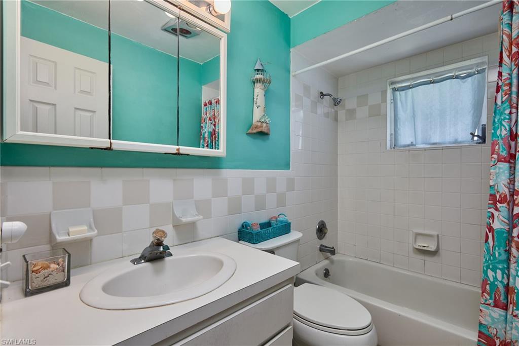 1660 South Hermitage Road Fort Myers, FL 33919 - Photo 20 of 21 a bathroom with a sink toilet and shower