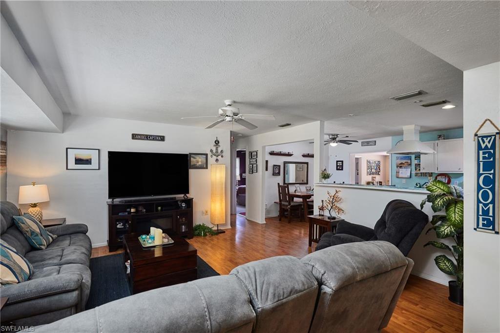 1660 South Hermitage Road Fort Myers, FL 33919 - Photo 6 of 21 a living room with furniture and a flat screen tv