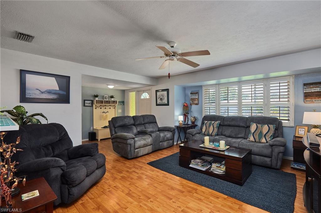 1660 South Hermitage Road Fort Myers, FL 33919 - Photo 7 of 21 a living room with furniture ceiling fan and a window