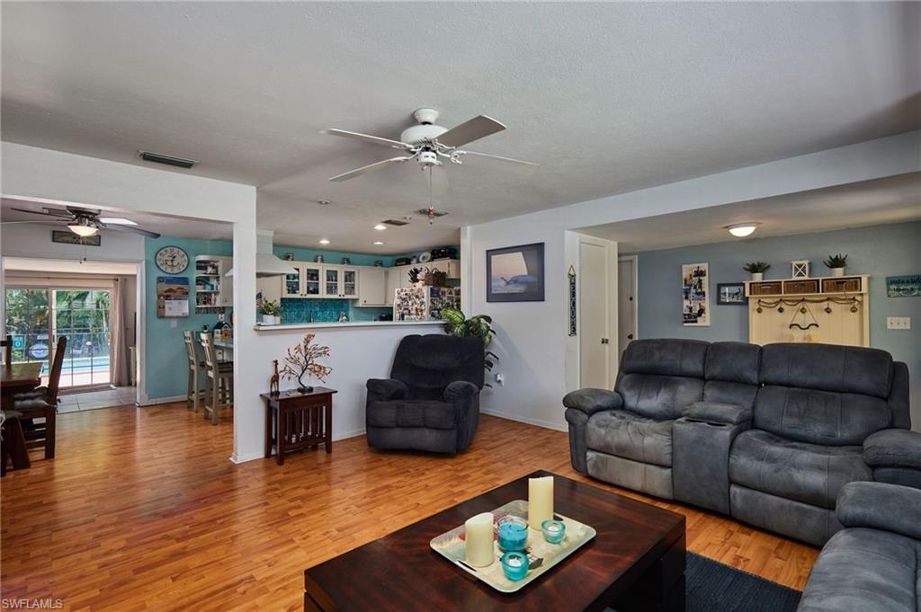 1660 South Hermitage Road Fort Myers, FL 33919 - Photo 8 of 21 a living room with furniture kitchen view and a wooden floor