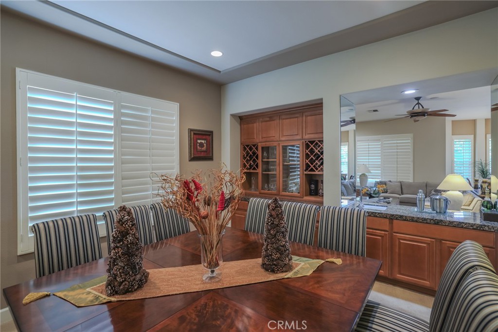 17 Bellisimo Court Rancho Mirage, CA 92270 - Photo 19 of 42 Formal dining room looking at the bar between dining room and family room
