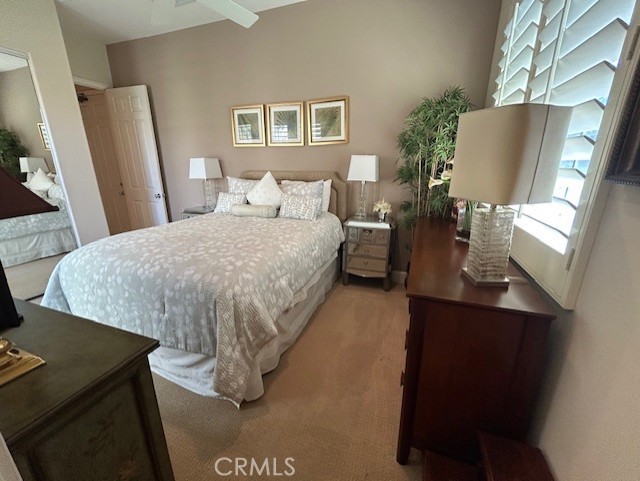 17 Bellisimo Court Rancho Mirage, CA 92270 - Photo 34 of 41 a bed room with a bed window and mirror