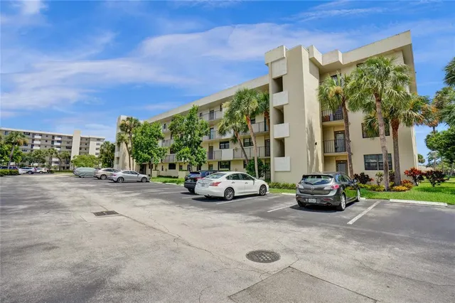 a view of a field with plants and trees