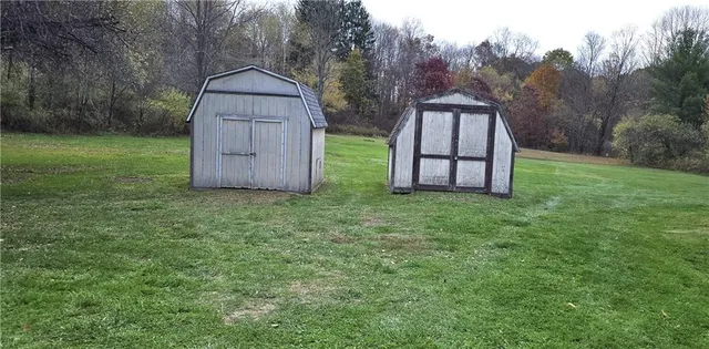 a backyard of a house with lots of green space