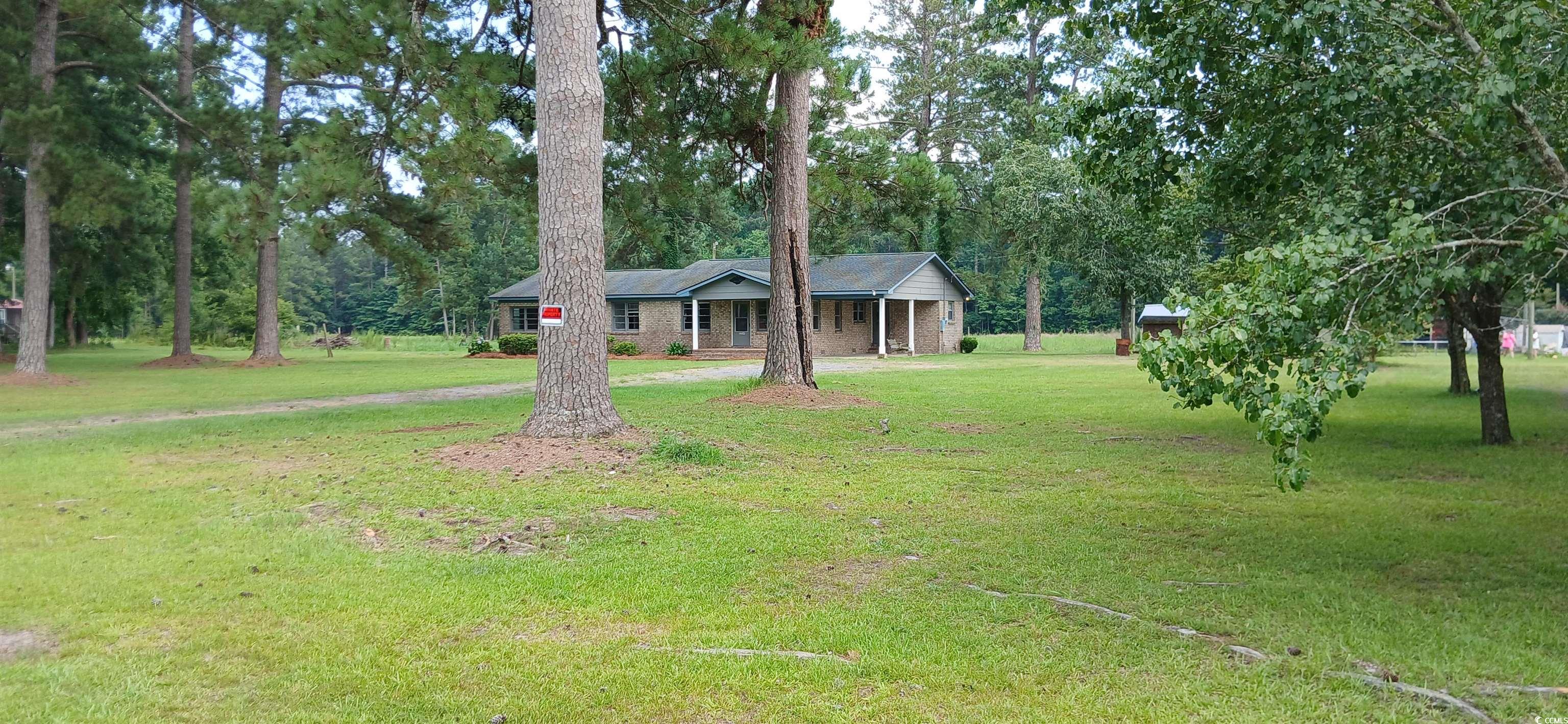 1206 French Road Mullins, SC 29574 - Photo 11 of 31 Single story home with a front yard and a porch