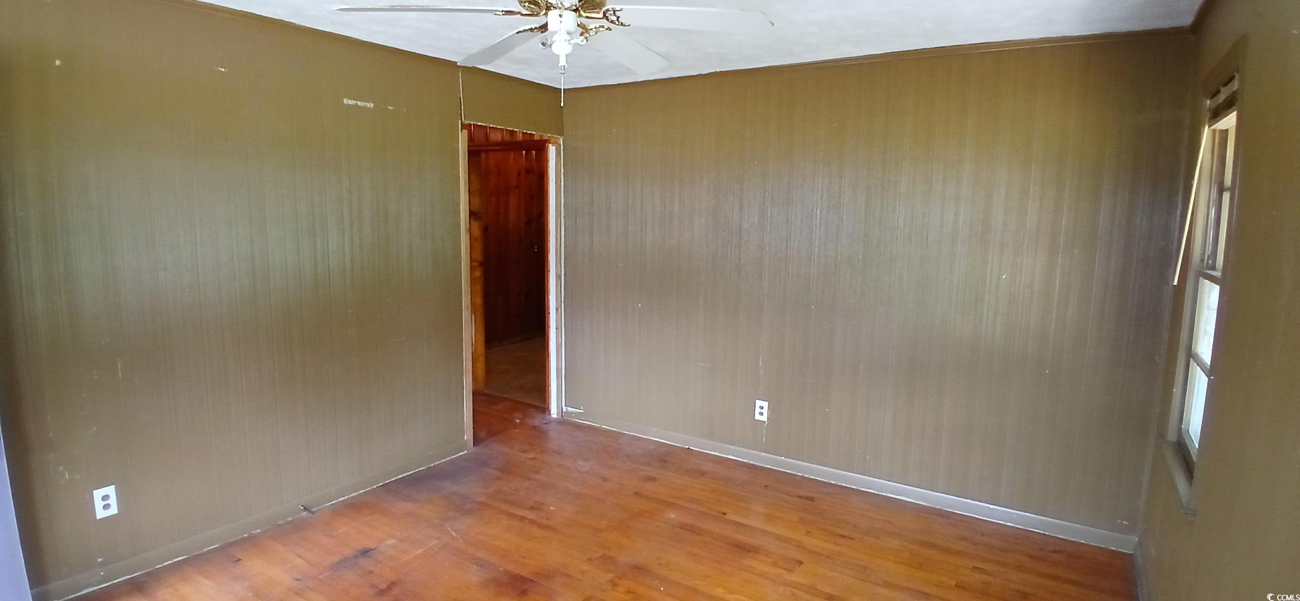 1206 French Road Mullins, SC 29574 - Photo 15 of 31 room with ceiling fan and wood finished floors