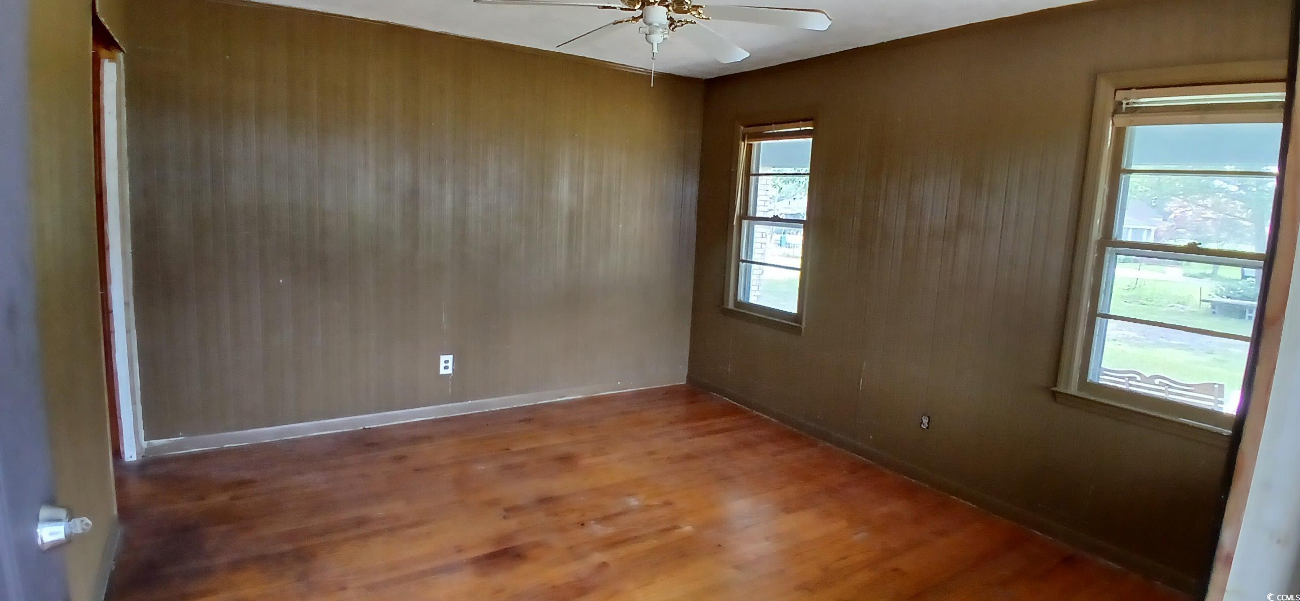 1206 French Road Mullins, SC 29574 - Photo 16 of 31 room featuring a ceiling fan, wood finished floors, and healthy amount of natural light