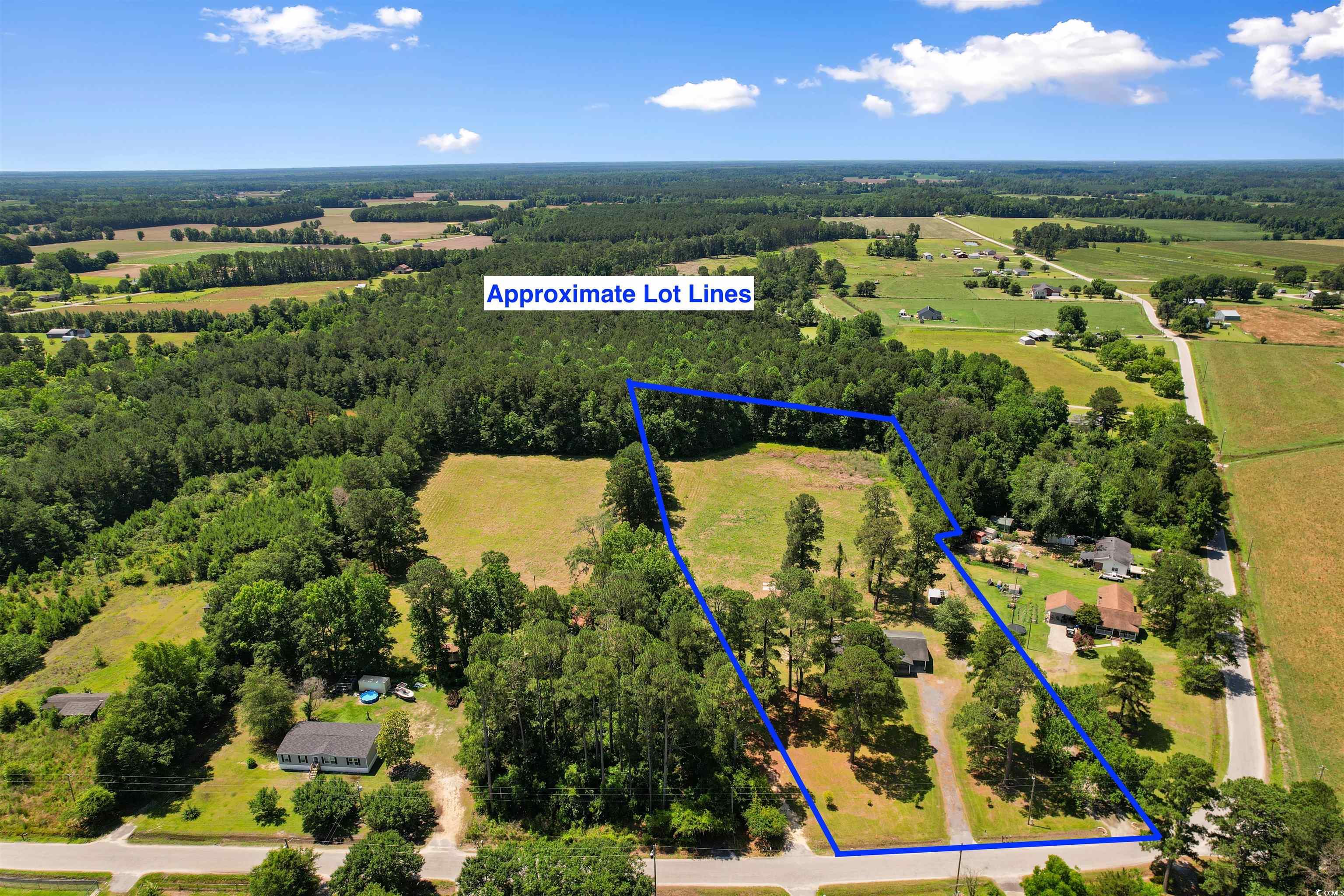 1206 French Road Mullins, SC 29574 - Photo 8 of 31 View of rural area with property parcel outlined and a heavily wooded area