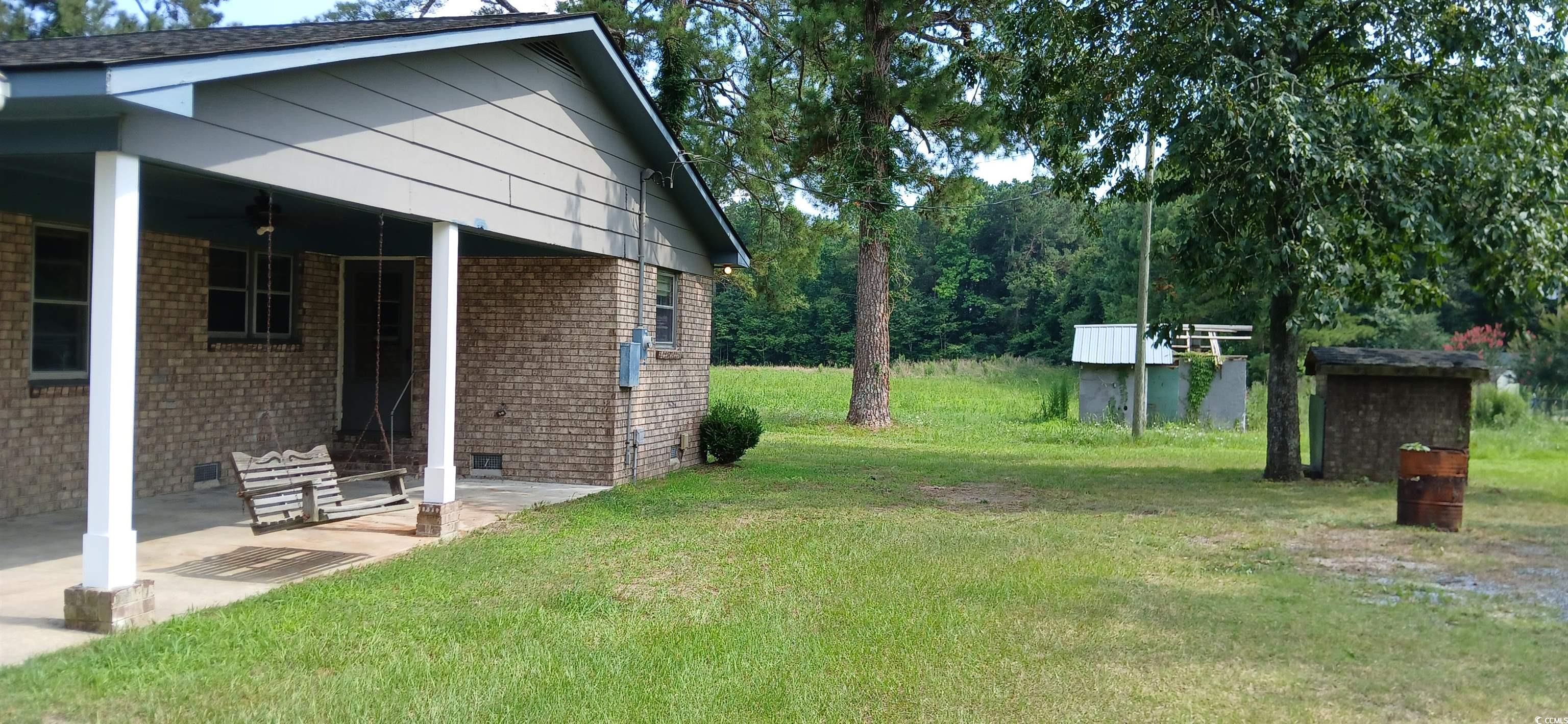 1206 French Road Mullins, SC 29574 - Photo 10 of 31 View of grassy yard with a patio