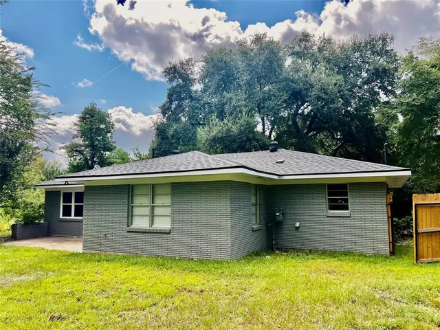a view of a field with a tree