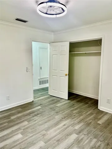 a view of an empty room and wooden floor