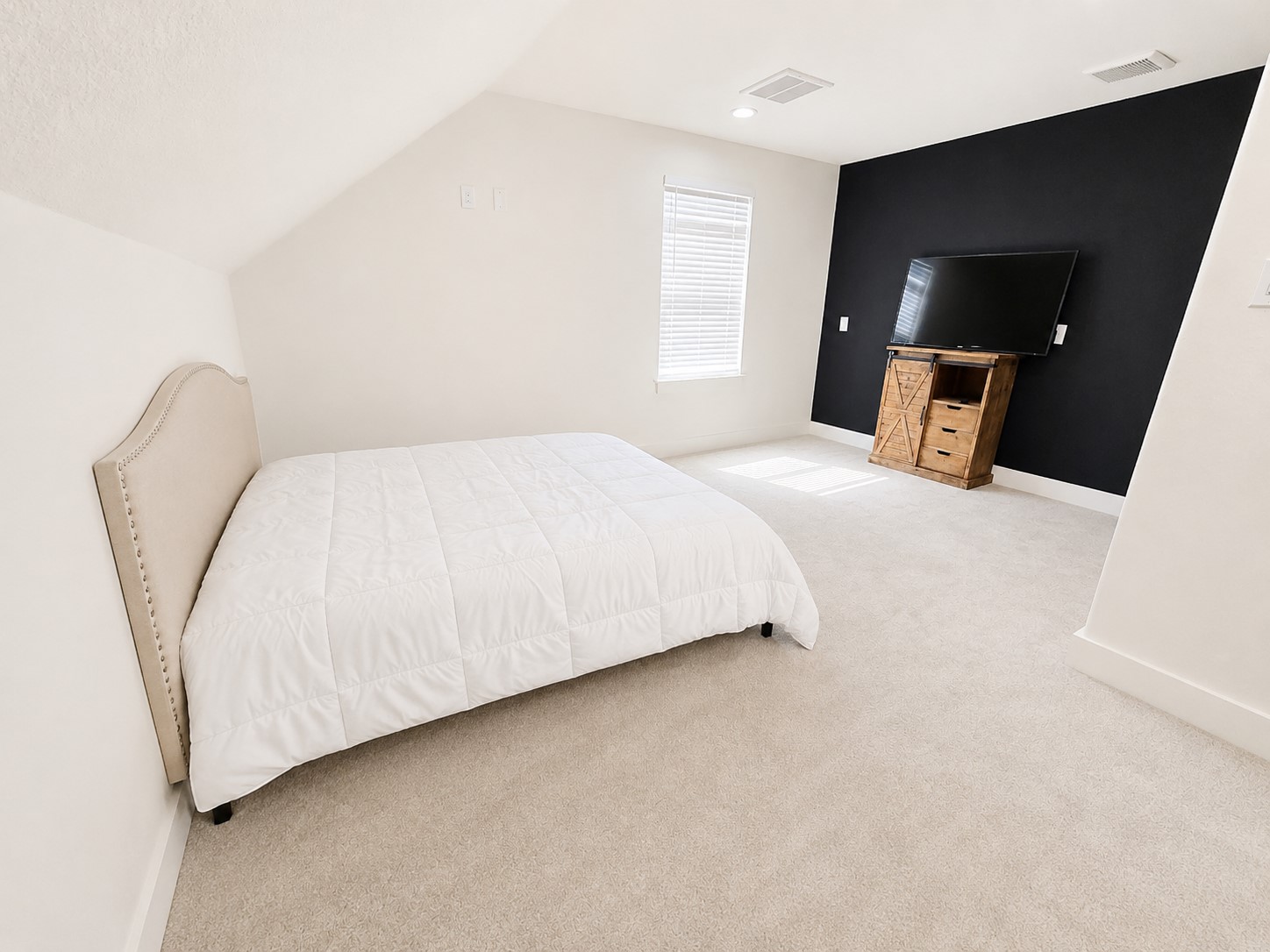 440 Farm To Market 223 Shepherd, TX 77371 - Photo 36 of 40 a bed room with a bed and a television