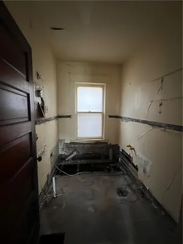 a storage and utility room with a window