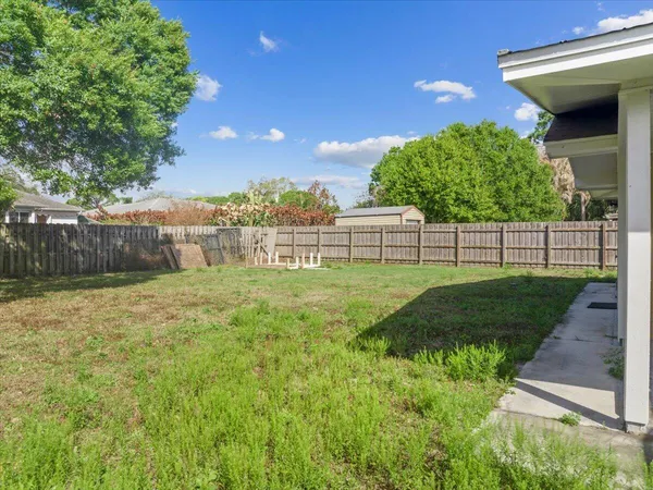 an aerial view of house with yard swimming pool and outdoor seating
