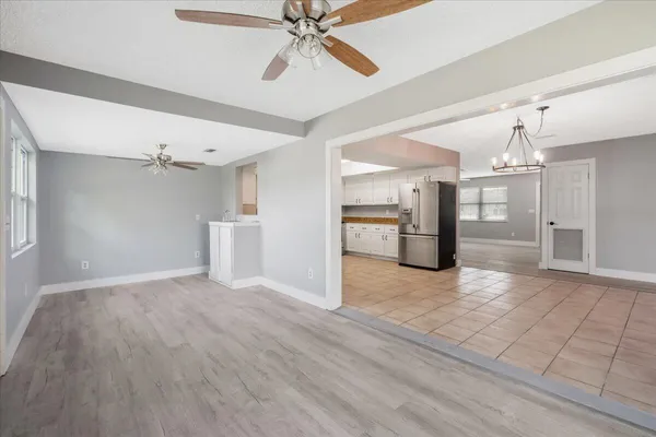 a view of a kitchen with a sink and cabinet