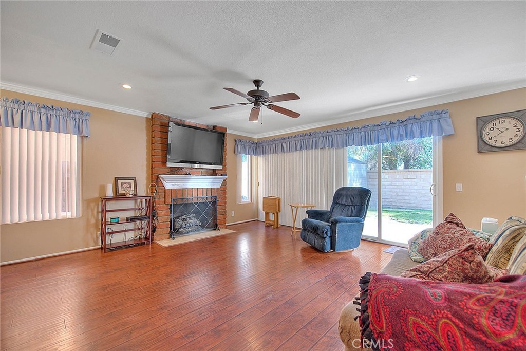 32 Rising Hill Road Phillips Ranch, CA 91766 - Photo 16 of 63 a living room with furniture and a fireplace