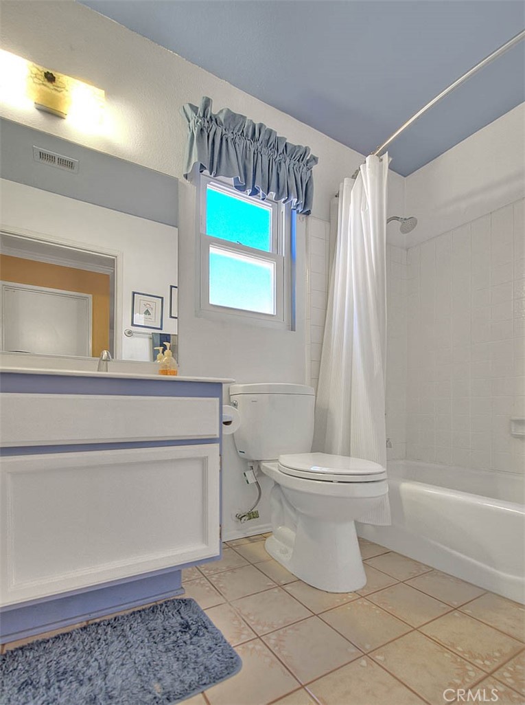 32 Rising Hill Road Phillips Ranch, CA 91766 - Photo 28 of 63 a bathroom with a toilet a sink and a mirror