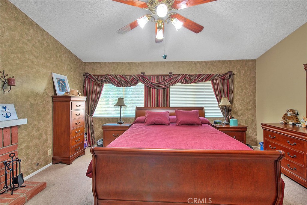 32 Rising Hill Road Phillips Ranch, CA 91766 - Photo 35 of 63 a bedroom with a bed and window