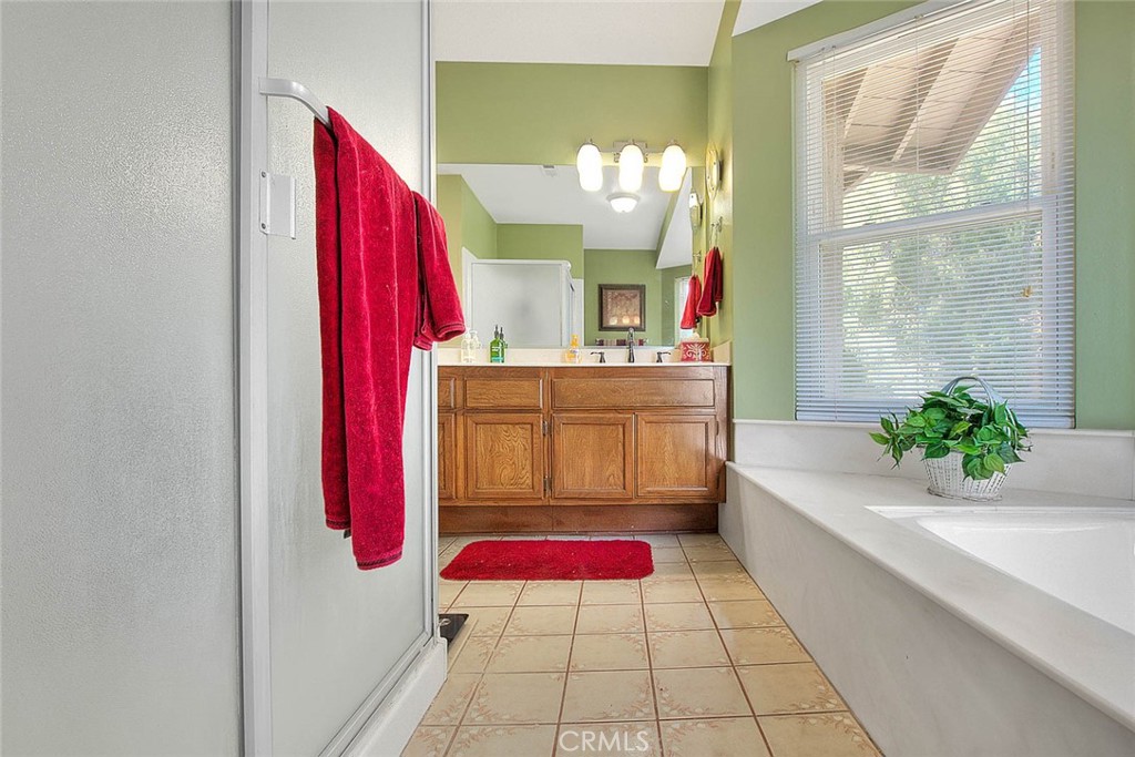 32 Rising Hill Road Phillips Ranch, CA 91766 - Photo 41 of 63 a bathroom with a tub sink and mirror