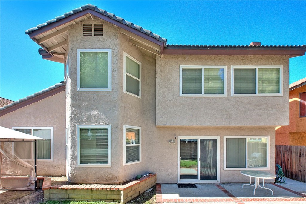 32 Rising Hill Road Phillips Ranch, CA 91766 - Photo 45 of 63 a front view of a house with a yard