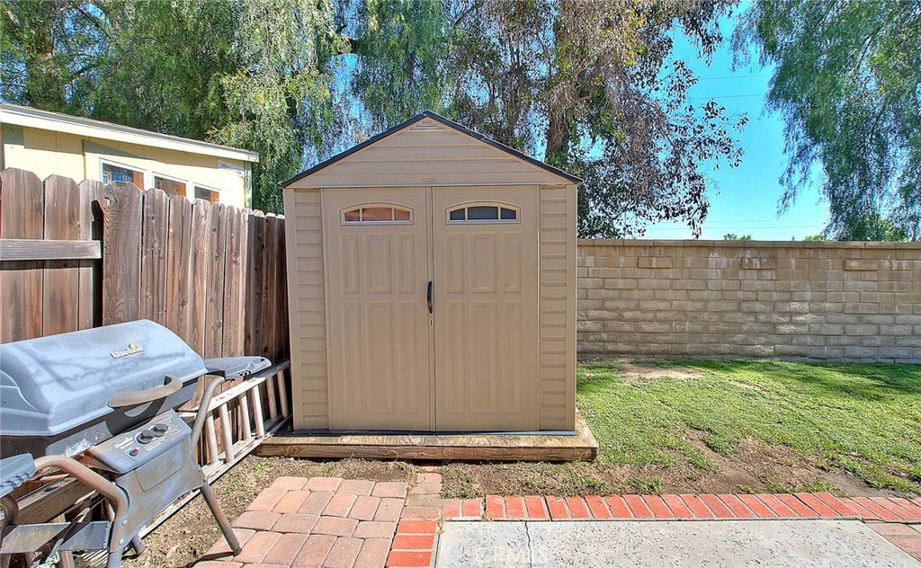 32 Rising Hill Road Phillips Ranch, CA 91766 - Photo 49 of 63 a front view of a house with garden
