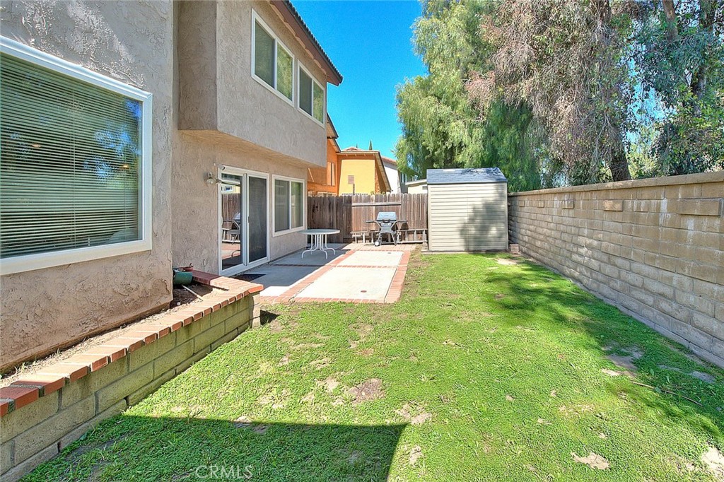 32 Rising Hill Road Phillips Ranch, CA 91766 - Photo 51 of 63 a view of a backyard with a large tree