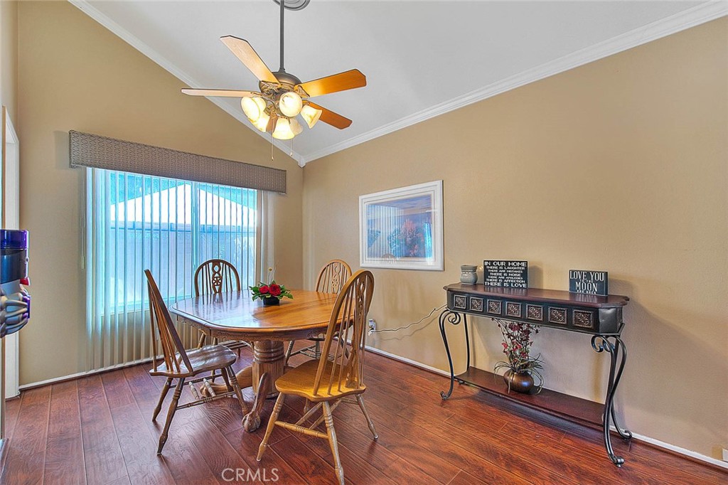 32 Rising Hill Road Phillips Ranch, CA 91766 - Photo 7 of 63 a dining room with furniture a chandelier and wooden floor