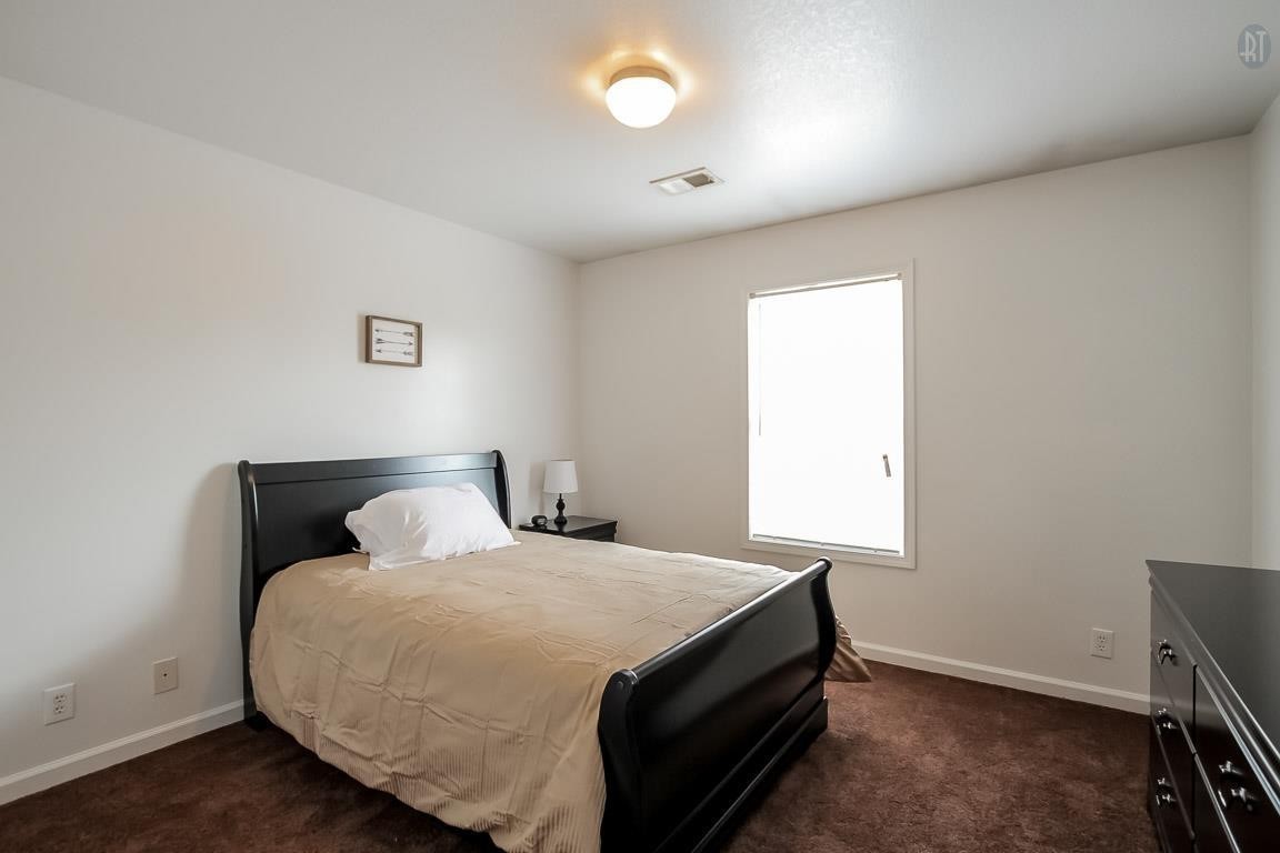 535 Lafayette Road, Unit H4 Clarksville, TN 37042 - Photo 16 of 24 a bedroom with a bed and a window