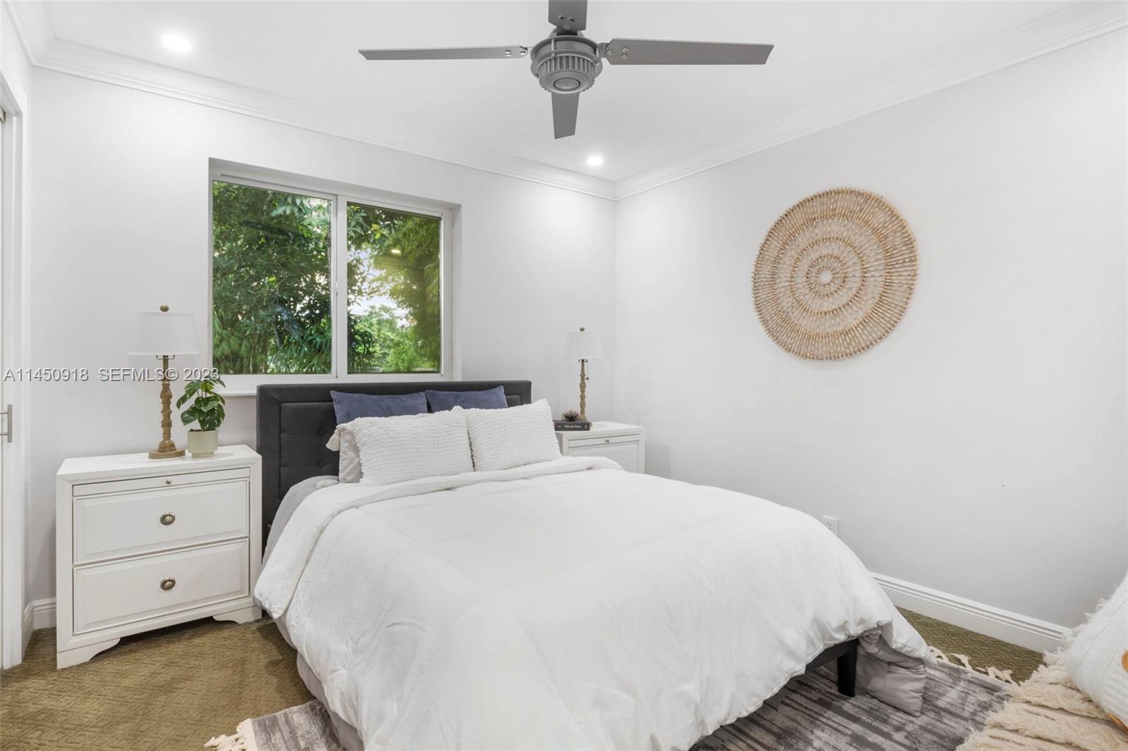 6410 Melaleuca Road Southwest Ranches, FL 33330 - Photo 14 of 50 a bedroom with a bed and a window