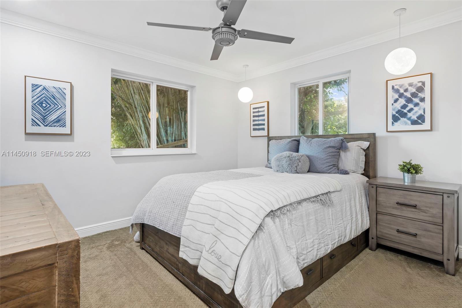 6410 Melaleuca Road Southwest Ranches, FL 33330 - Photo 15 of 50 a bedroom with a bed and a window