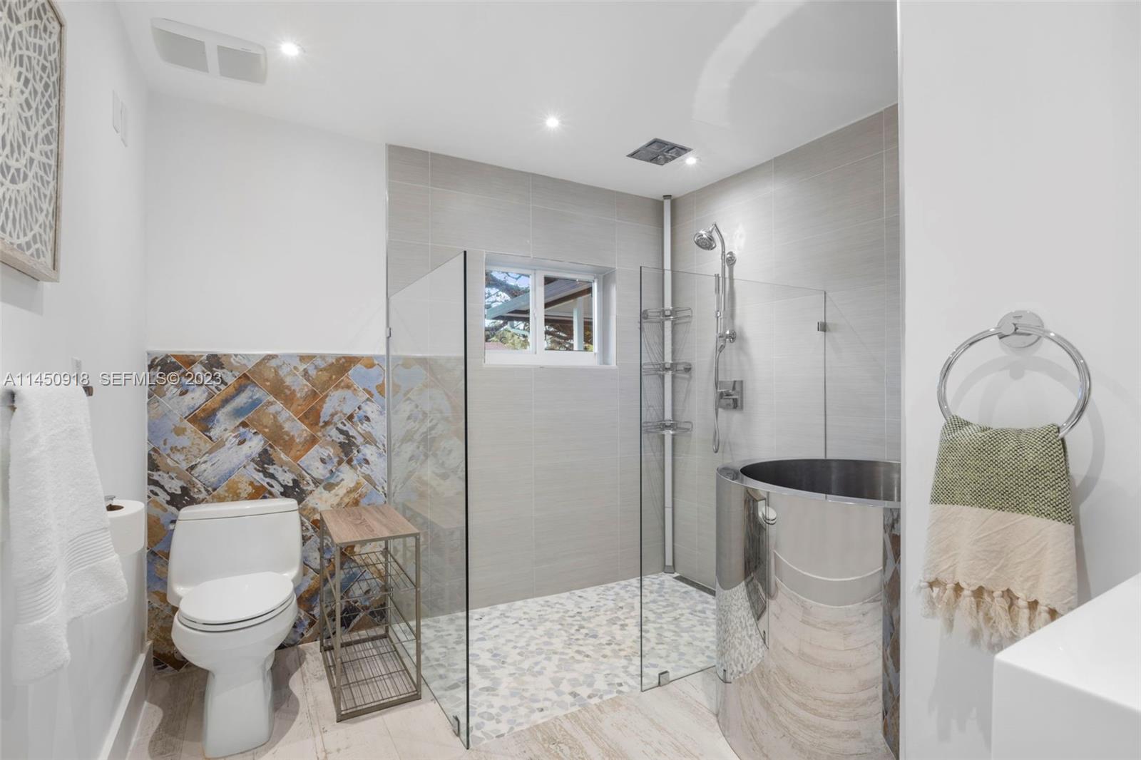 6410 Melaleuca Road Southwest Ranches, FL 33330 - Photo 18 of 50 a bathroom with a toilet sink and shower