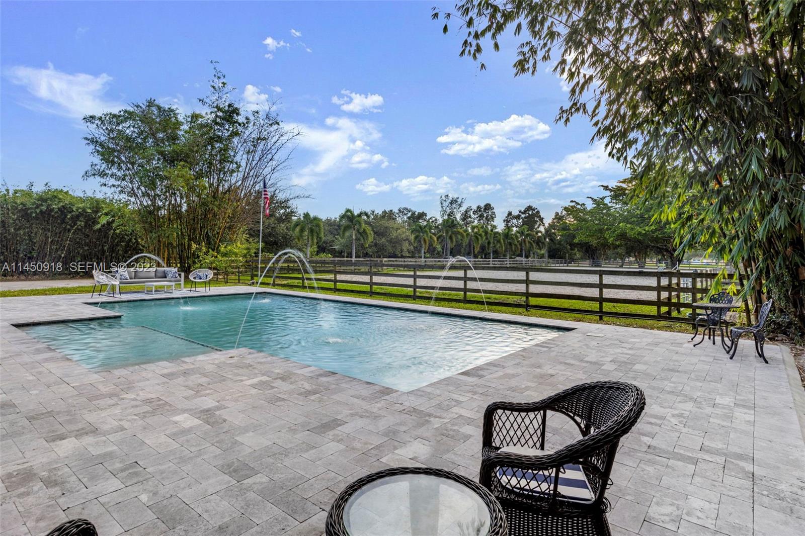 6410 Melaleuca Road Southwest Ranches, FL 33330 - Photo 21 of 50 a view of swimming pool with a backyard and trees