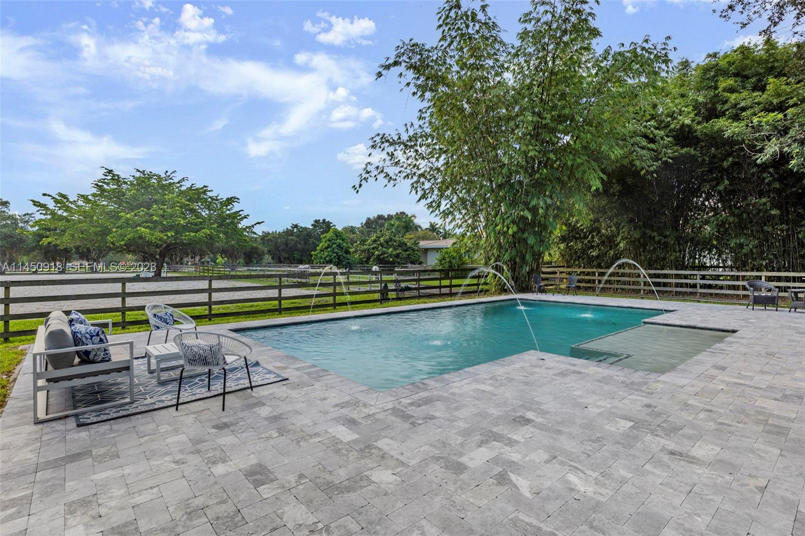 6410 Melaleuca Road Southwest Ranches, FL 33330 - Photo 22 of 50 a view of swimming pool with a yard