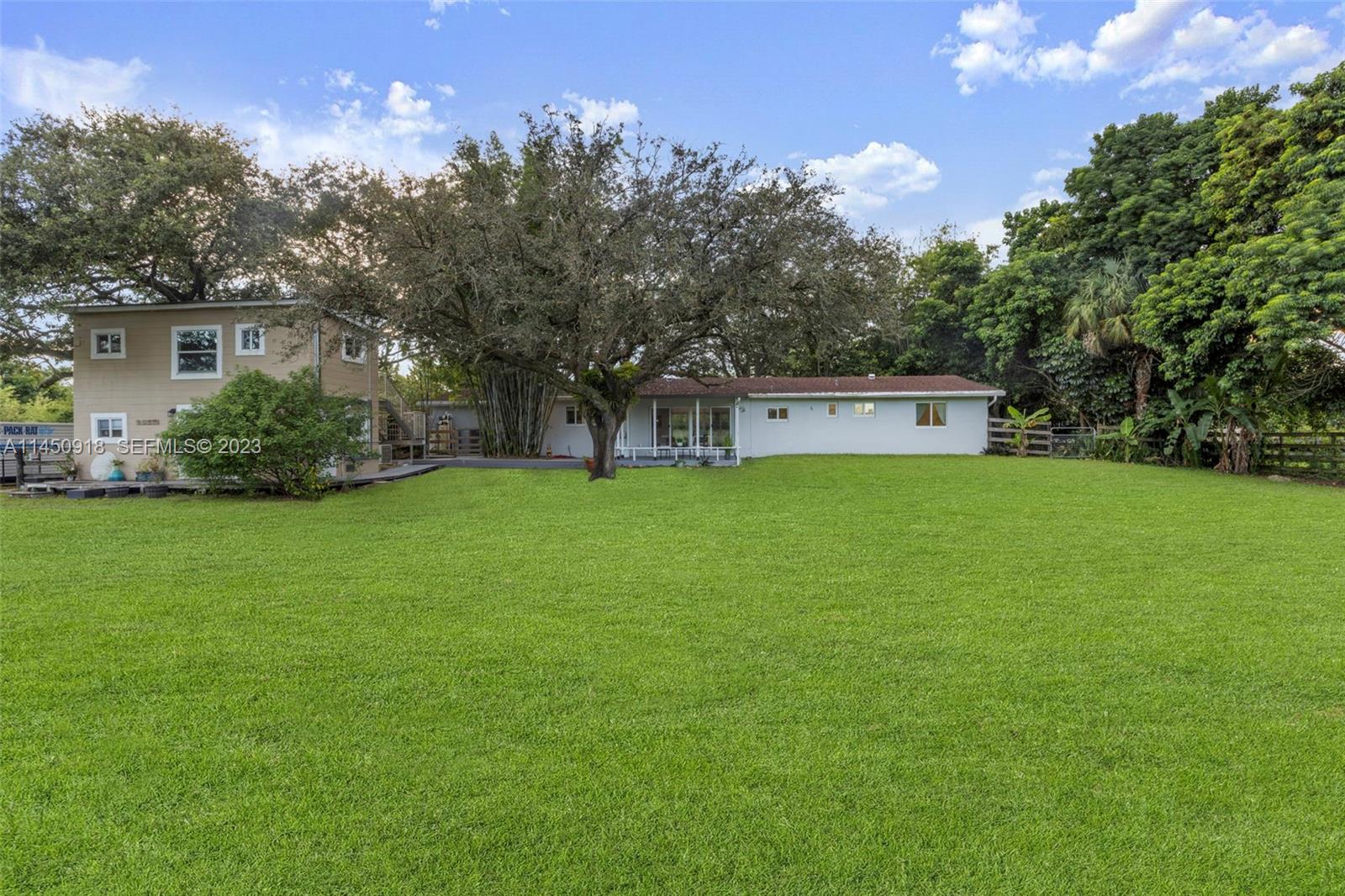 6410 Melaleuca Road Southwest Ranches, FL 33330 - Photo 31 of 50 a view of a house with a yard porch and sitting area
