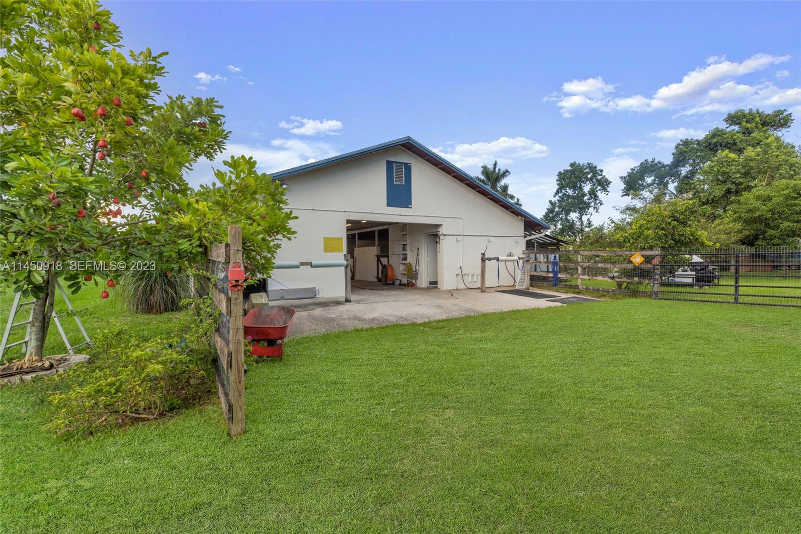 6410 Melaleuca Road Southwest Ranches, FL 33330 - Photo 32 of 50 a view of a house with a yard and sitting area