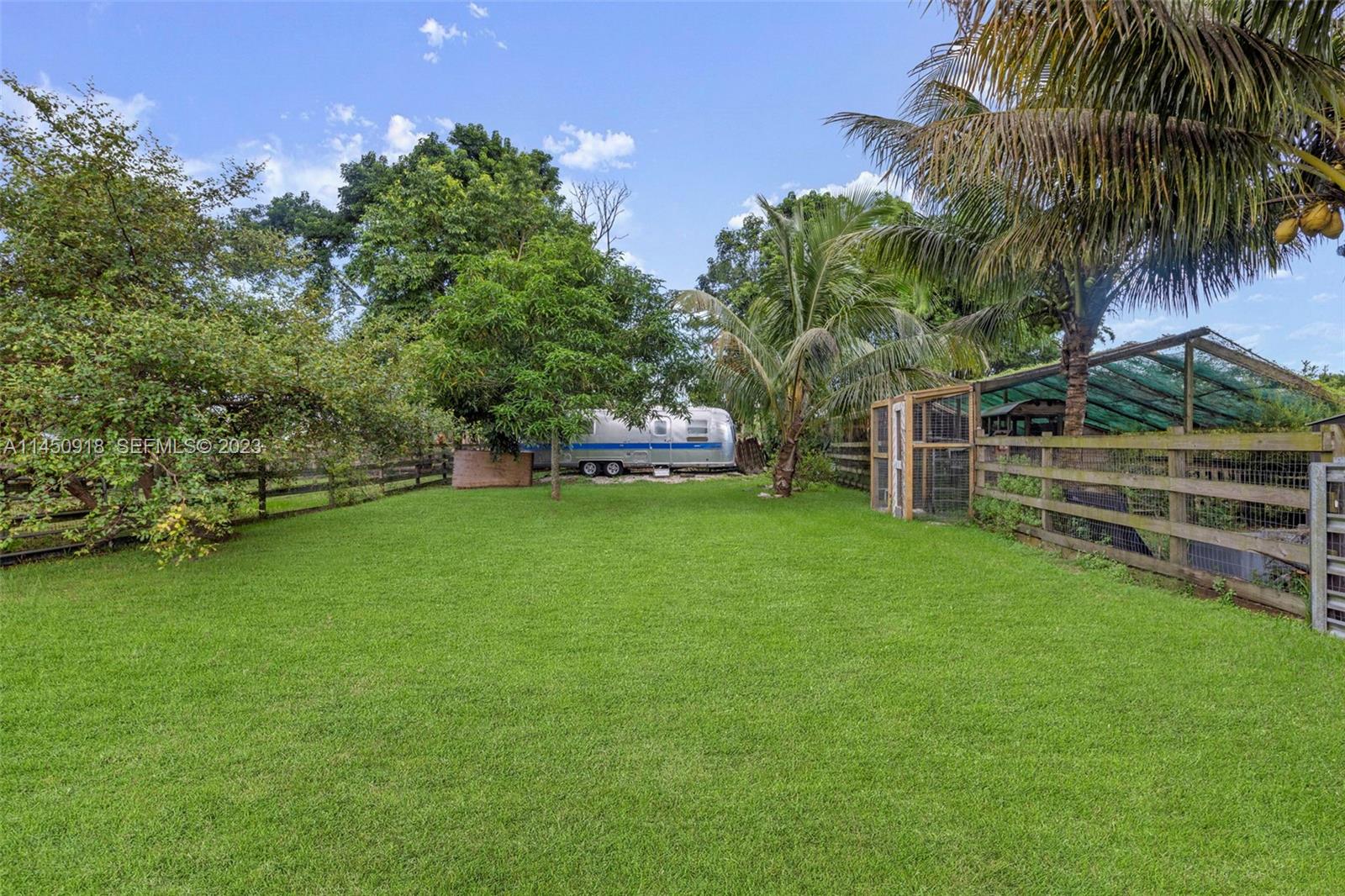 6410 Melaleuca Road Southwest Ranches, FL 33330 - Photo 35 of 50 a view of a house with a yard