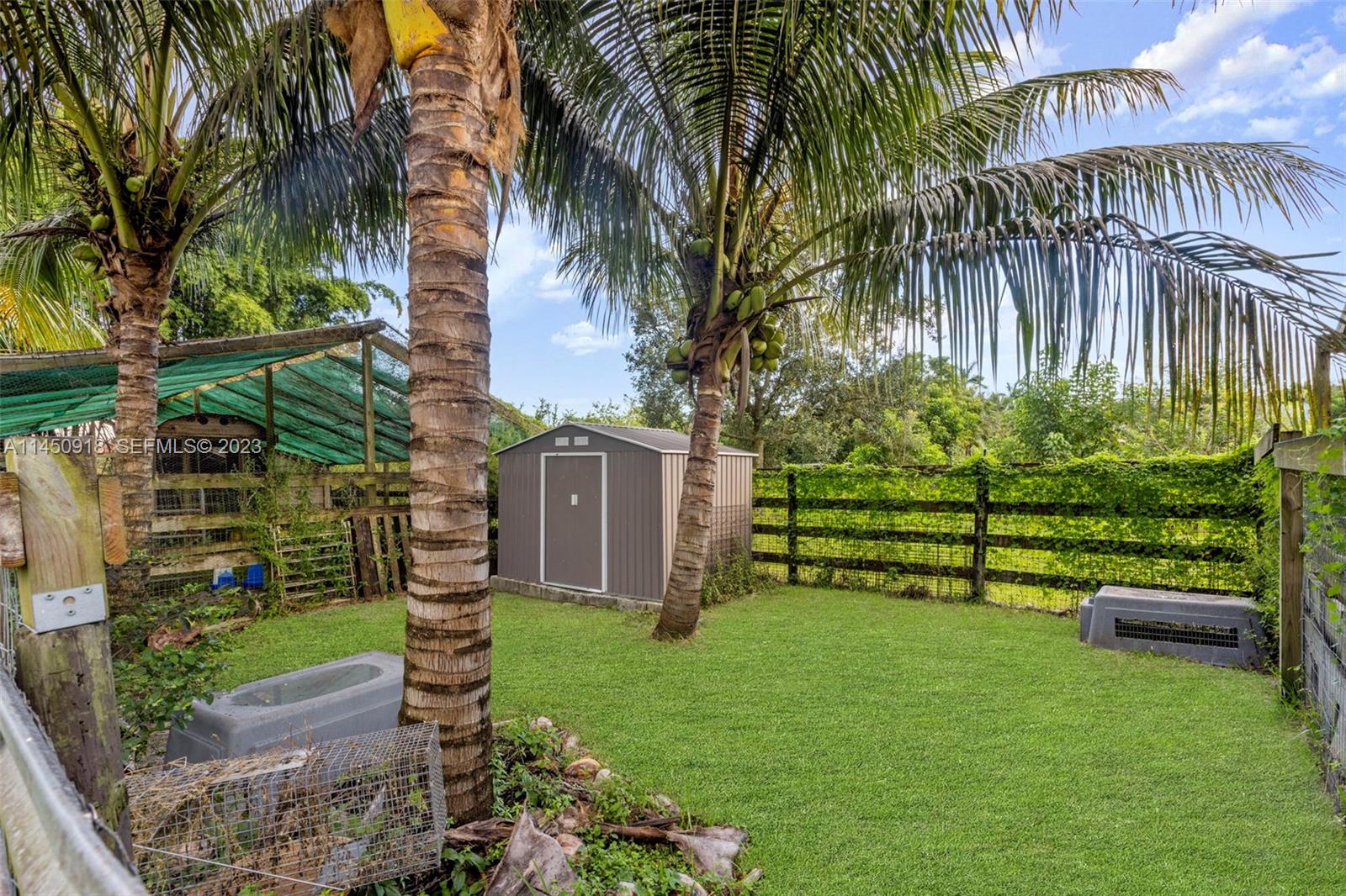 6410 Melaleuca Road Southwest Ranches, FL 33330 - Photo 36 of 50 a garden with palm trees