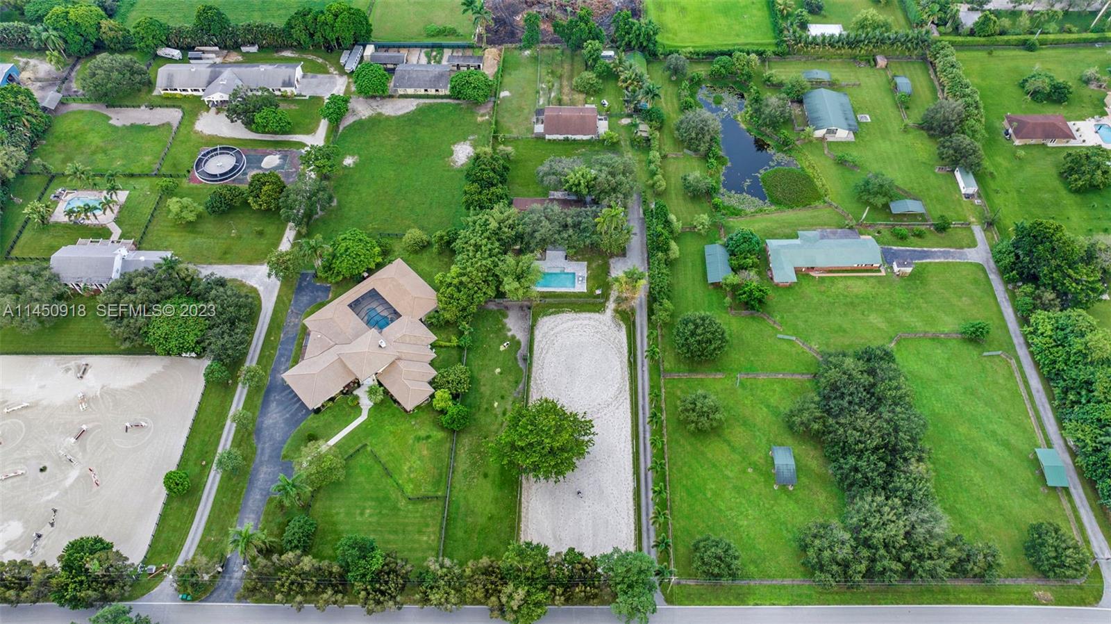 6410 Melaleuca Road Southwest Ranches, FL 33330 - Photo 45 of 50 an aerial view of residential houses with outdoor space and street view