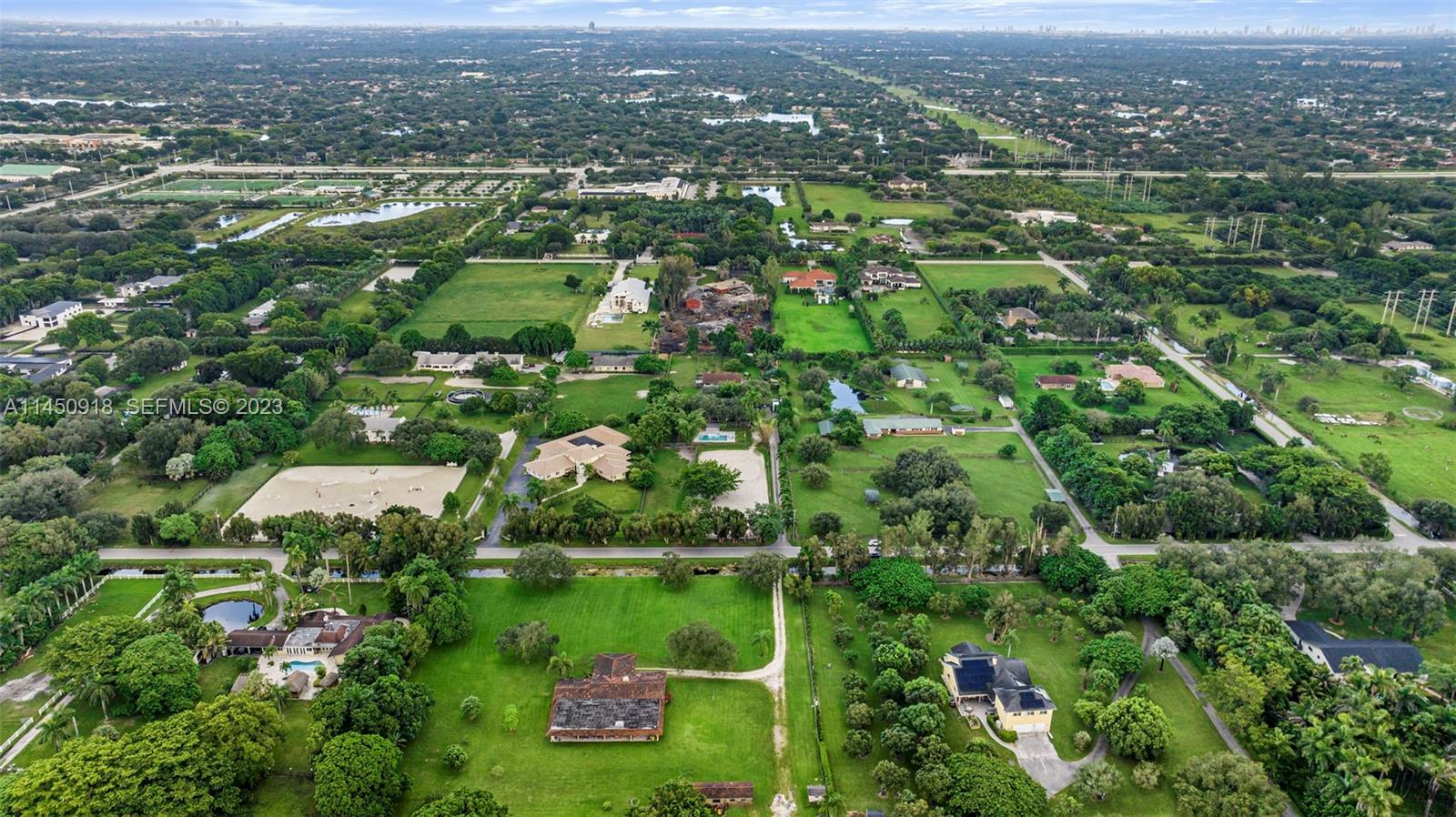 6410 Melaleuca Road Southwest Ranches, FL 33330 - Photo 49 of 50 an aerial view of residential houses with outdoor space and trees