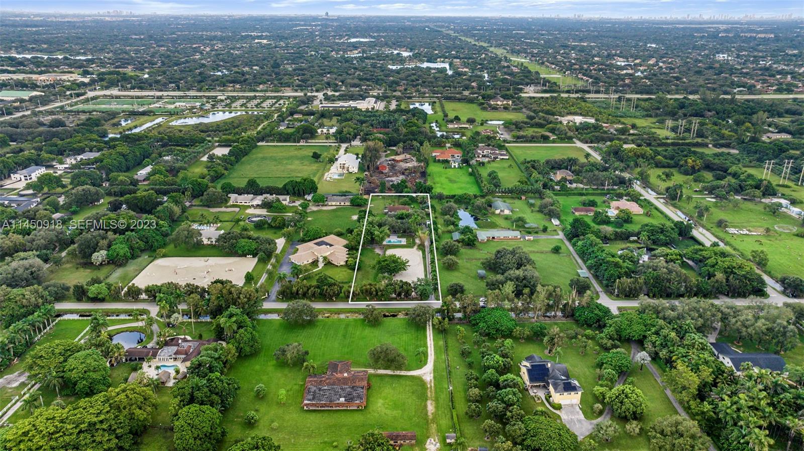 6410 Melaleuca Road Southwest Ranches, FL 33330 - Photo 50 of 50 an aerial view of residential houses with outdoor space and trees